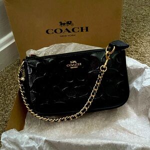 NWOT in original box Coach small purse/wristlet.
